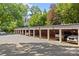 A long line of individual carports offers shaded parking at 108 Colville Rd # 21B, Charlotte, NC 28207