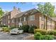 Classic brick building features a manicured landscape, timeless architectural details, and convenient parking at 108 Colville Rd # 21B, Charlotte, NC 28207