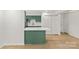 Open-concept living space with a kitchen featuring stylish green cabinetry and modern finishes at 108 Colville Rd # 21B, Charlotte, NC 28207