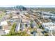 Stunning aerial view of modern townhomes with Charlotte skyline in background on a sunny day at 111 W Poindexter Dr, Charlotte, NC 28203