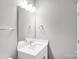 Modern bathroom featuring a sleek vanity, updated fixtures, and a bright, clean design at 111 W Poindexter Dr, Charlotte, NC 28203