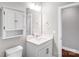 Bright bathroom featuring a medicine cabinet, mirror, and a vanity with a quartz countertop at 111 W Poindexter Dr, Charlotte, NC 28203