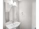 Bright bathroom featuring a modern sink, faucet, mirror, and natural light at 111 W Poindexter Dr, Charlotte, NC 28203