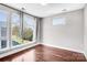 Bright bedroom with large windows offering natural light and views of the surrounding landscape at 111 W Poindexter Dr, Charlotte, NC 28203