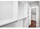 Walk-in closet featuring built-in shelving and ample storage space, providing organized convenience at 111 W Poindexter Dr, Charlotte, NC 28203