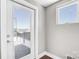 Hallway with access to a balcony or patio area, featuring a glass door and window for natural light at 111 W Poindexter Dr, Charlotte, NC 28203