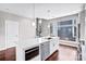 Modern kitchen featuring a central island, stainless steel appliances, and hardwood floors at 111 W Poindexter Dr, Charlotte, NC 28203