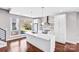 Modern kitchen with a large island, stainless steel appliances, and hardwood floors at 111 W Poindexter Dr, Charlotte, NC 28203