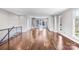 Sunlit living area showcasing beautiful hardwood floors and access to the modern kitchen at 111 W Poindexter Dr, Charlotte, NC 28203