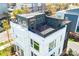 A roof deck area features outdoor string lights and a sleek, modern design at 111 W Poindexter Dr, Charlotte, NC 28203