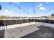 Rooftop deck with city views, string lights, and a spacious area for outdoor activities and relaxation at 111 W Poindexter Dr, Charlotte, NC 28203