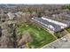 Enjoy the open lawn space in this aerial view of this charming community with mature trees and manicured landscaping at 1224 Green Oaks Ln # I, Charlotte, NC 28205
