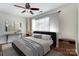 Serene bedroom boasts modern decor, ceiling fan, and a cozy seating, creating a personal retreat at 1224 Green Oaks Ln # I, Charlotte, NC 28205