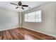 Bright bedroom with ceiling fan features hardwood floors and a window that brings in natural light at 1224 Green Oaks Ln # I, Charlotte, NC 28205