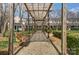 Exterior view of townhomes featuring a wooden pergola walkway, enhancing the community's outdoor space and charm at 1224 Green Oaks Ln # I, Charlotte, NC 28205