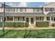 Charming townhouse exterior with lush landscaping and inviting front doors, perfect for a cozy neighborhood feel at 1224 Green Oaks Ln # I, Charlotte, NC 28205