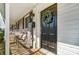 Charming front door with a wreath, sitting area, and decorative accents, creating a welcoming entrance at 1224 Green Oaks Ln # I, Charlotte, NC 28205