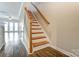 Entryway with wood stairs, hard surface floors, and a view to the living room at 1224 Green Oaks Ln # I, Charlotte, NC 28205