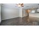 Bright living area featuring an open floor plan, hard surface flooring, and modern fixtures at 1224 Green Oaks Ln # I, Charlotte, NC 28205