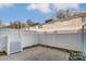 Private fenced patio offers an outdoor space with a concrete area and decorative lattice panel at 1224 Green Oaks Ln # I, Charlotte, NC 28205