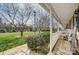 Inviting porch area with seating, overlooking a well-maintained lawn and mature trees, enhancing outdoor living at 1224 Green Oaks Ln # I, Charlotte, NC 28205