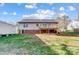 The home features a lawn, mature trees and an elevated deck with a brick foundation at 124 Washington St, York, SC 29745