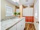 Bathroom with a granite countertop vanity and tiled shower at 124 Washington St, York, SC 29745