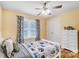 Comfortable bedroom with a full bed, a ceiling fan, and a large window at 124 Washington St, York, SC 29745