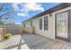 A charming elevated wooden deck features decorative railings and a door into the home at 124 Washington St, York, SC 29745