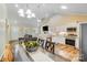 Bright open floor plan kitchen with stainless appliances, granite countertops and dining table at 124 Washington St, York, SC 29745