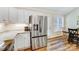 Kitchen with stainless steel refrigerator, granite countertops, and white cabinets at 124 Washington St, York, SC 29745