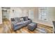 Living room with gray sofa, vaulted ceiling, and lots of natural light at 124 Washington St, York, SC 29745