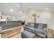 Living room with a gray sofa, vaulted ceiling, and open view to kitchen at 124 Washington St, York, SC 29745