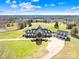 Aerial view of a luxurious estate boasting a sprawling lawn and private driveway at 12613 Oak Grove Rd, Stanfield, NC 28163