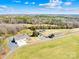 Aerial view of entire property showcasing home, barn, pastures and surrounding land at 12613 Oak Grove Rd, Stanfield, NC 28163