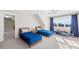 Bright bedroom featuring two twin beds, blue accents, and a large window offering plenty of sunlight at 12613 Oak Grove Rd, Stanfield, NC 28163