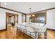 Bright kitchen boasts a marble-topped island with seating and stylish pendant lighting at 12613 Oak Grove Rd, Stanfield, NC 28163