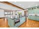 Kitchen boasts a green island with built-in microwave and view of the dining area at 12613 Oak Grove Rd, Stanfield, NC 28163