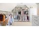 Organized walk-in closet featuring custom shelving, drawers, and ample hanging space for clothing at 12613 Oak Grove Rd, Stanfield, NC 28163