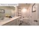 Well-lit bathroom features a double sink vanity and a shower-tub combo at 1325 Secrest Commons Dr, Monroe, NC 28112