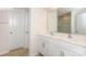 Modern bathroom featuring double sinks, white cabinets, and a glass-enclosed shower at 1325 Secrest Commons Dr, Monroe, NC 28112