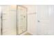 Clean bathroom showcases a glass-door shower with white tile and a neutral-toned floor at 1325 Secrest Commons Dr, Monroe, NC 28112