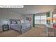 Inviting bedroom features calming decor, a comfortable bed, and natural light from the window at 1325 Secrest Commons Dr, Monroe, NC 28112