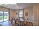 Dining room with wood floors and sliding glass door leading to back yard at 1325 Secrest Commons Dr, Monroe, NC 28112
