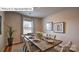 Inviting dining room with a large window and views, hardwood floors and seating for six at 1325 Secrest Commons Dr, Monroe, NC 28112