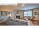 Bright living room with hardwood floors, a fireplace, modern decor, and comfortable seating at 1325 Secrest Commons Dr, Monroe, NC 28112