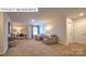 Comfortable living room offers a well-lit space for relaxation with plush chairs and a dedicated workspace at 1325 Secrest Commons Dr, Monroe, NC 28112