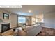 Bright, open living room with fireplace and view into the kitchen at 1325 Secrest Commons Dr, Monroe, NC 28112