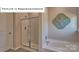 Clean bathroom showcasing a glass-enclosed shower and a large soaking tub at 1344 Secrest Commons Ct, Monroe, NC 28112