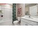 Clean bathroom with a white vanity, modern fixtures, and a shower-tub combination at 1344 Secrest Commons Ct, Monroe, NC 28112